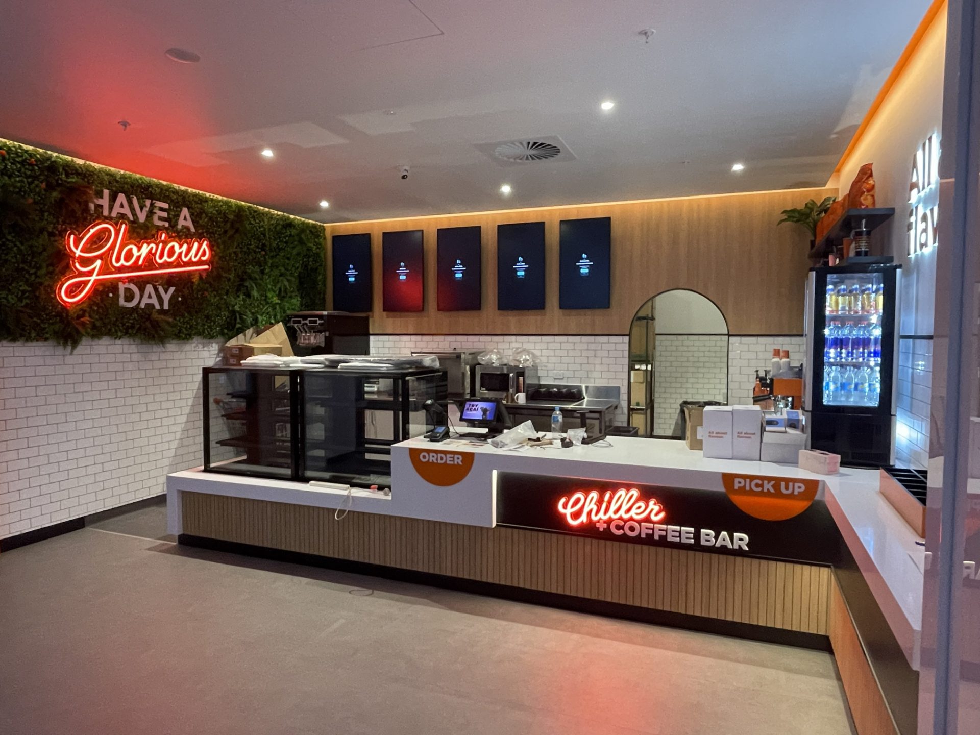 Completed cafe fitout with counter and feature wall